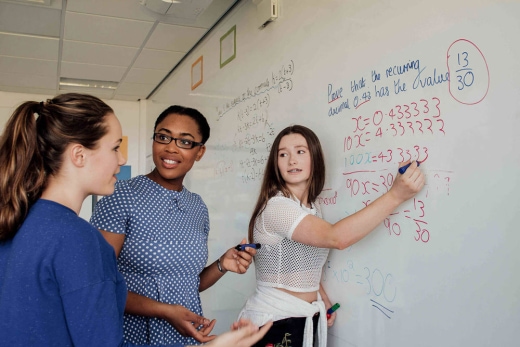 students working on whiteboard